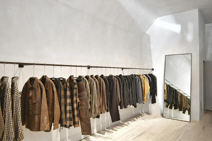 a room with a wall of clothes on the wall
